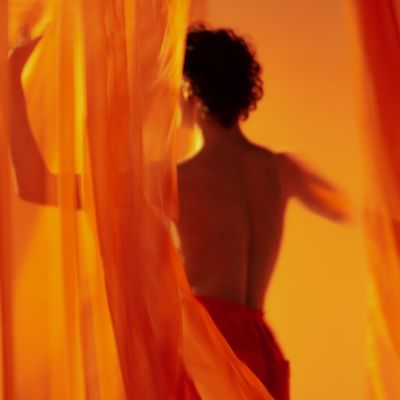 Person captured mid-movement, showing fluidity and grace.